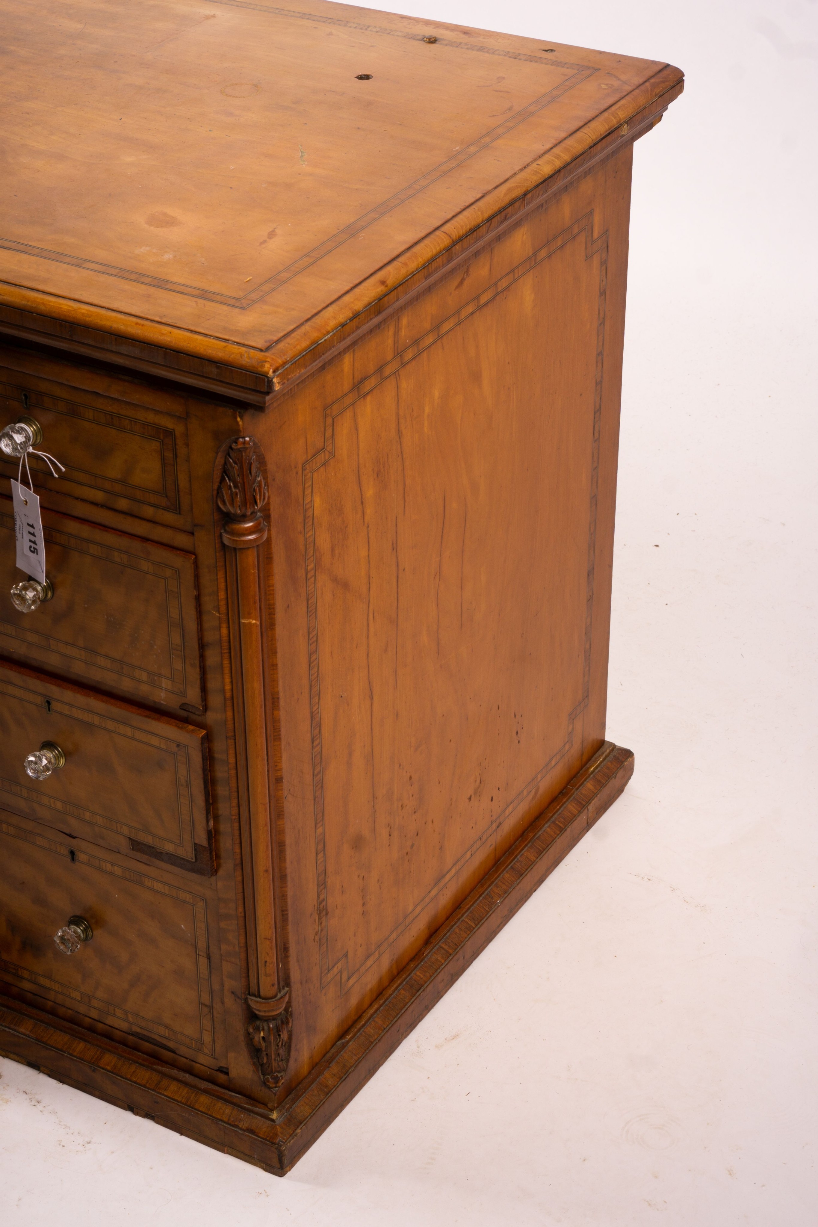 A late Victorian banded satinwood kneehole desk, width 138cm, depth 67cm, height 71cm